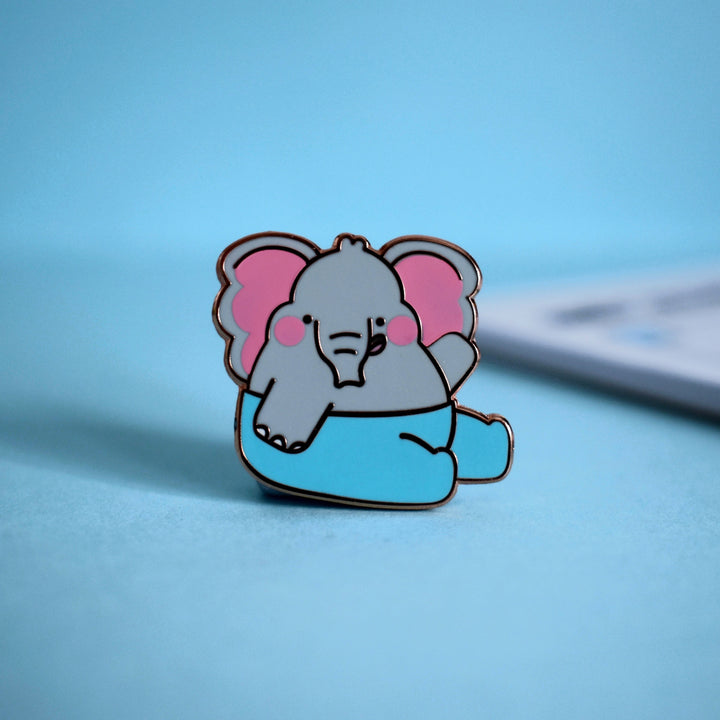 Elephant enamel pin on blue background