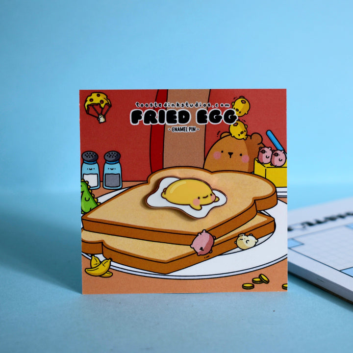Fried egg enamel pin on toast backing card