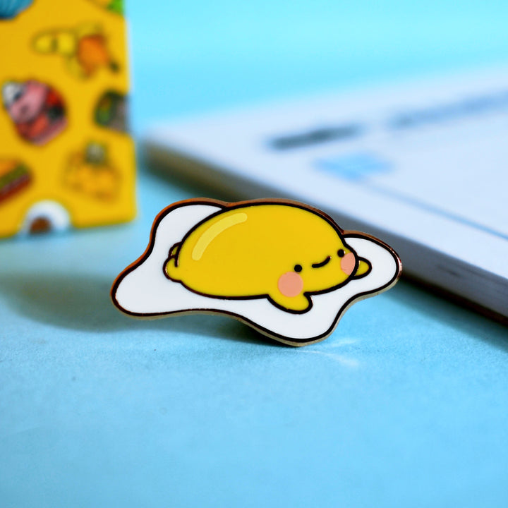 Fried egg enamel pin with notebook
