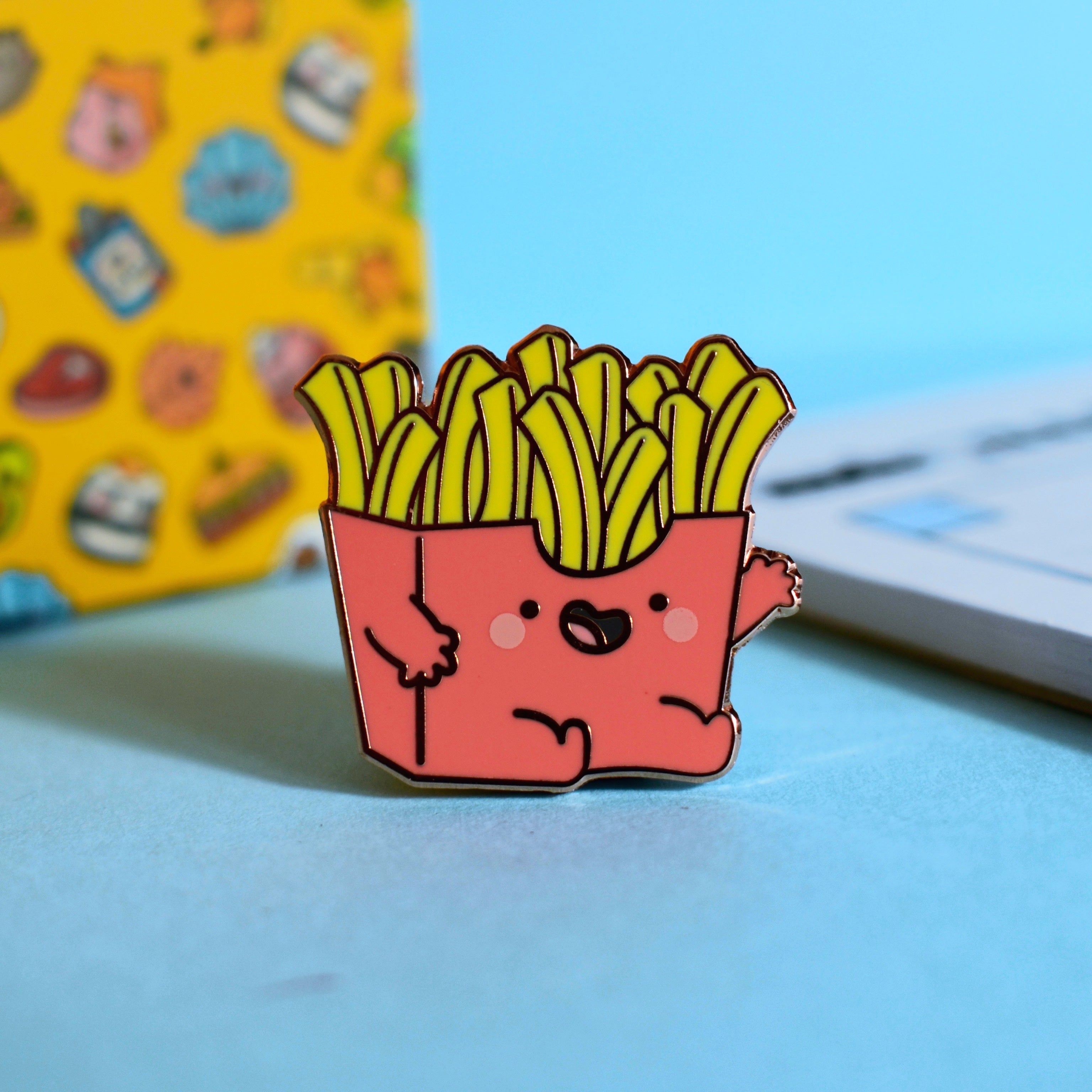 French fries enamel pin with notebook
