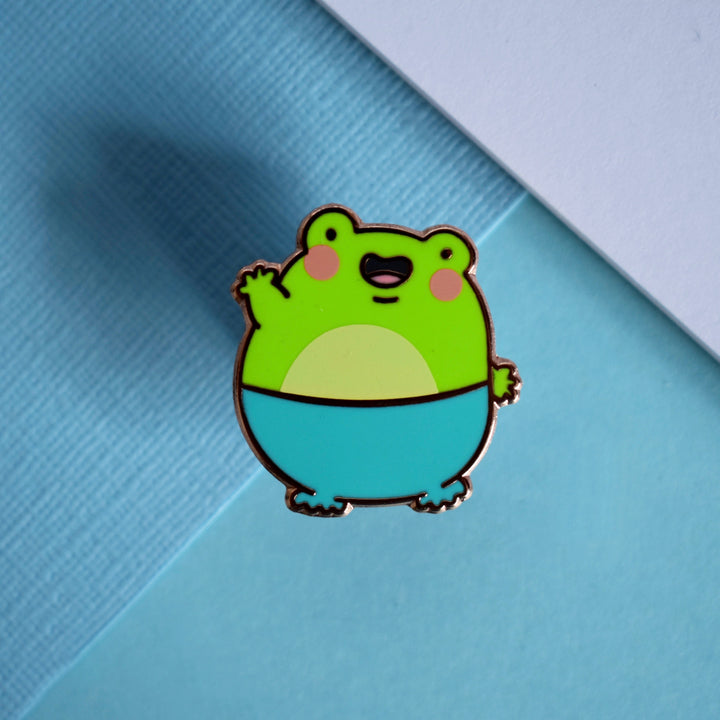 frog pin on blue background