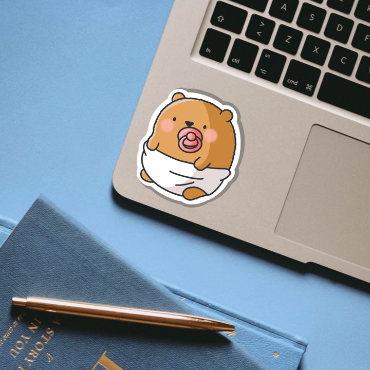 Bear dressed as baby vinyl sticker on laptop