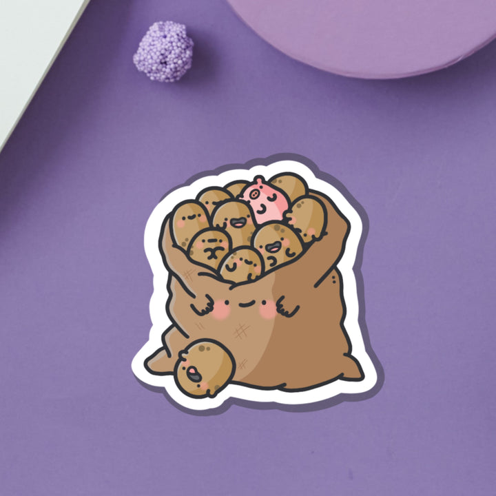Bag of potatoes vinyl sticker on purple background