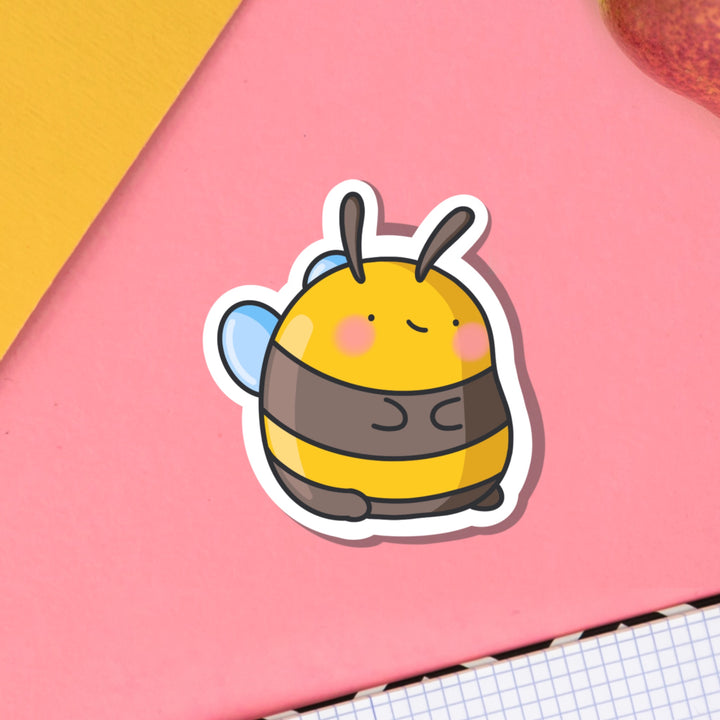 Bumblebee Vinyl sticker on pink table and notebook