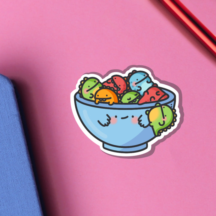 Bowl of dinosaurs vinyl sticker on pink table
