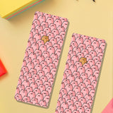 Pig bookmarks on yellow table