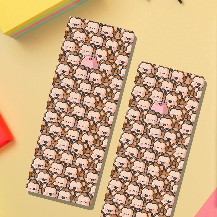 Cute monkey bookmarks on yellow table