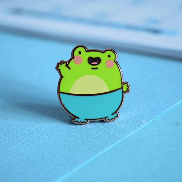 frog pin on blue table