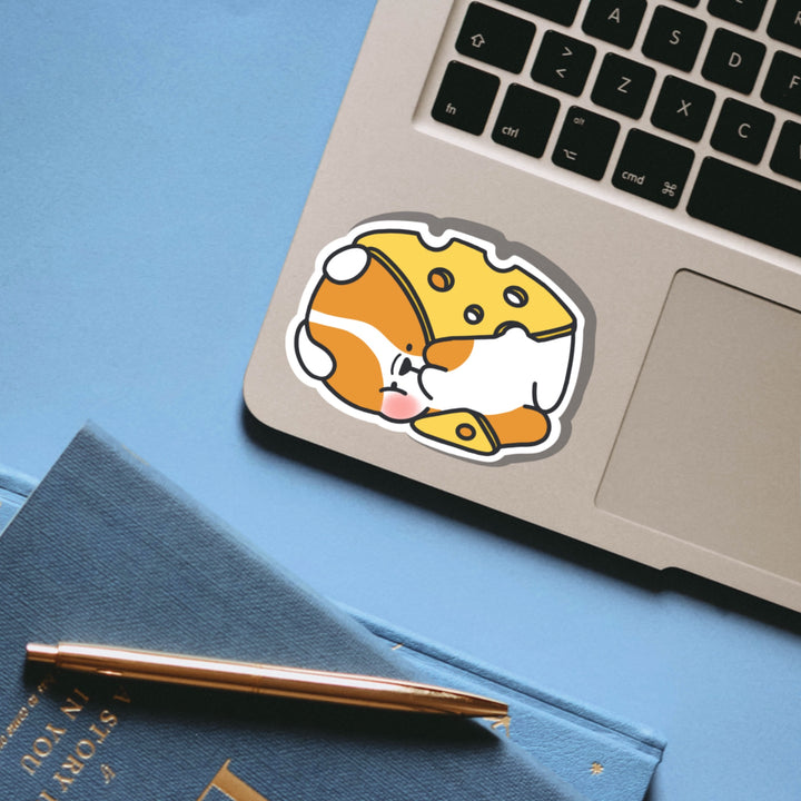 Dog wrapped in cheese vinyl sticker on laptop