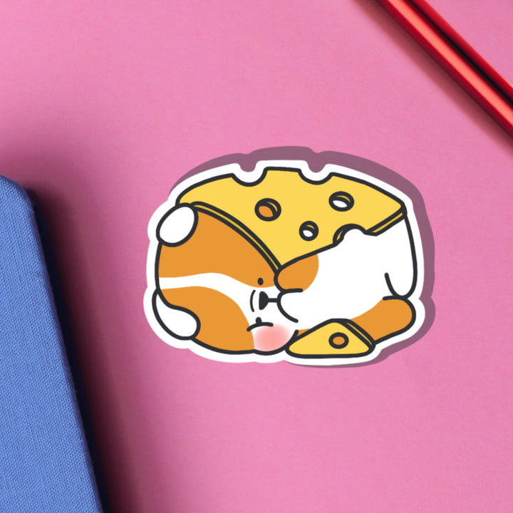 Dog wrapped in cheese vinyl sticker on pink table