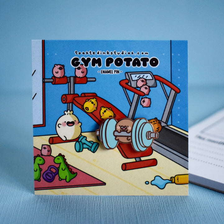 Potato holding weights pin on gym backing card