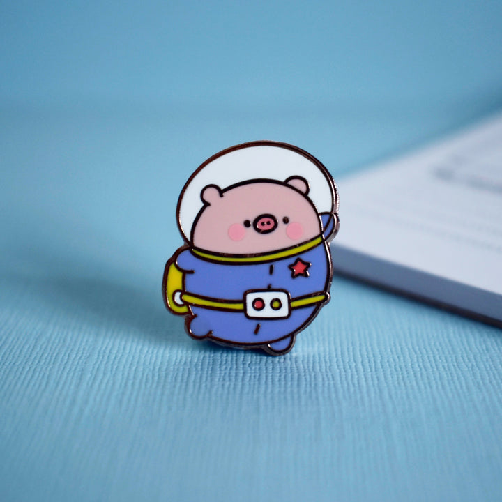 pig pin on blue table