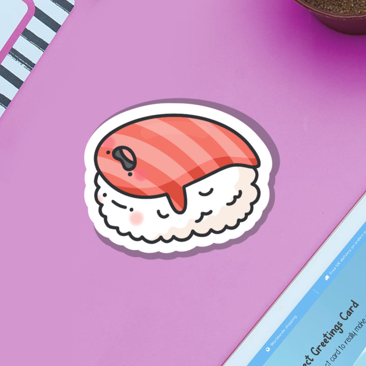 Salmon sushi vinyl sticker on purple table with ipad