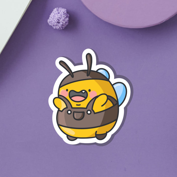 Bumblebee wearing dungarees vinyl sticker on purple background