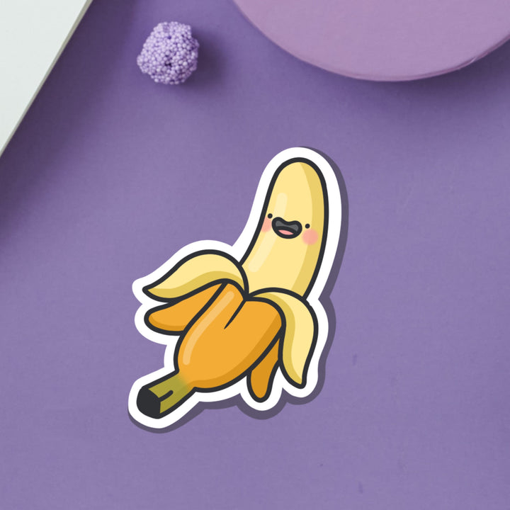 Happy banana vinyl sticker on purple table