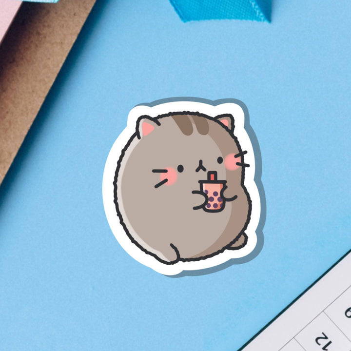 Cat drinking bubble tea vinyl sticker on blue background