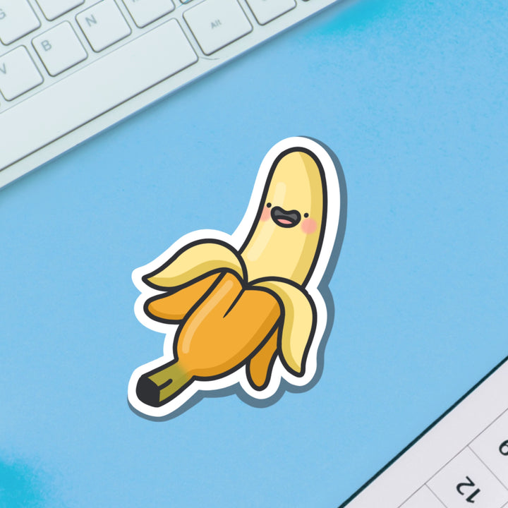 Happy banana vinyl sticker on blue table
