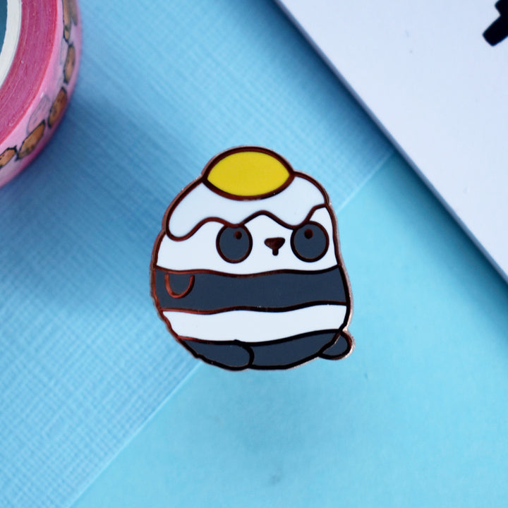 panda pin on blue table