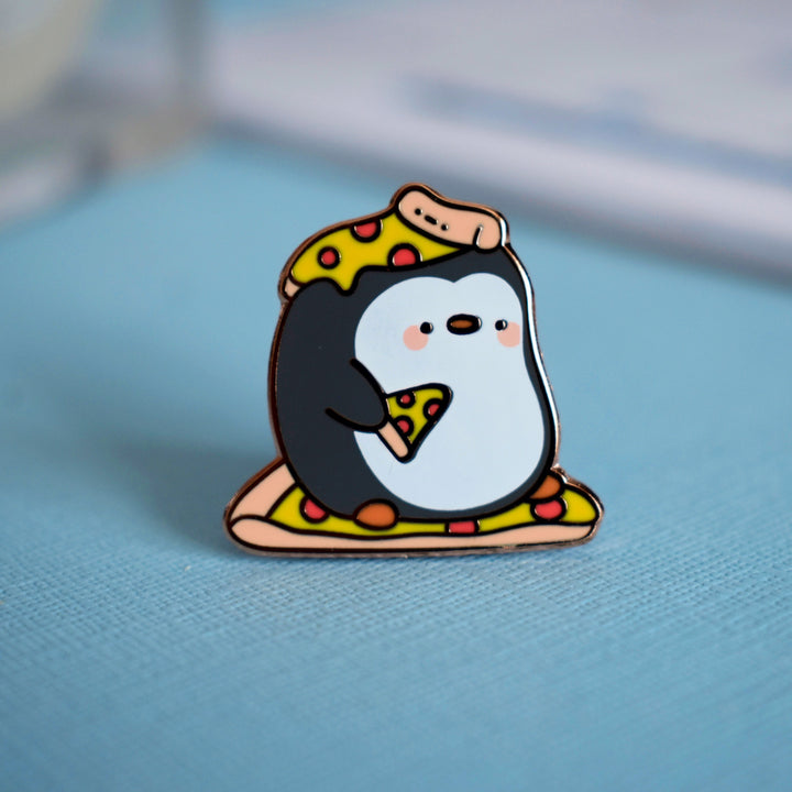 pizza penguin pin on blue background