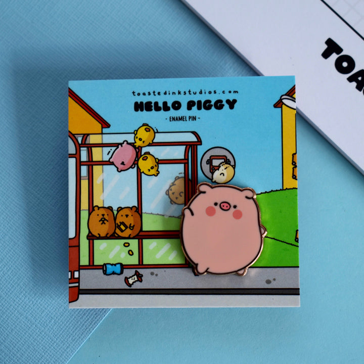 Pig at bus stop enamel pin on backing card