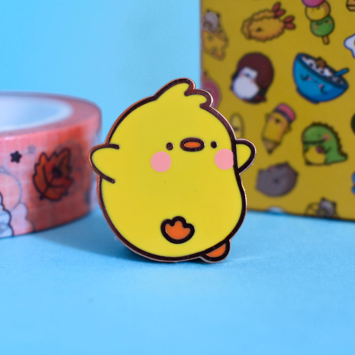 Cute chick pin with washi tape on blue table