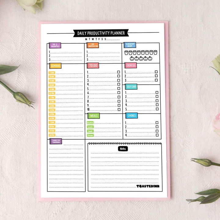 A5 Daily desk pad Planner on pink table