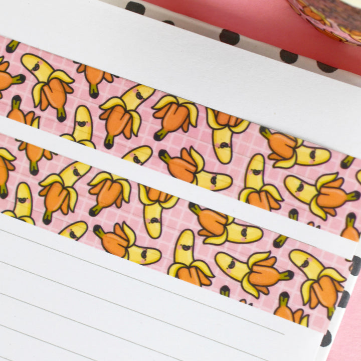 Banana print washi tape on a lined notebook